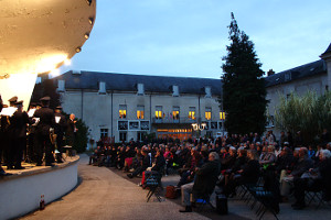 Harmonie de Joigny director Thierry Bouchier begins, with a large crowd outside of the Hotel de Ville