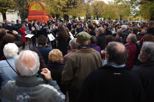 Thierry Bouchier takes the massed group, with a large crowd listening on