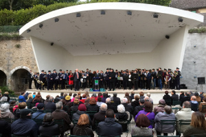 The massed bands on the stage outside the Hotel de Ville