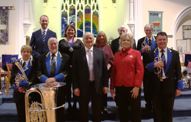 Band committee members with local Godalming Town Council, Waverley and Surrey councillors at the launch of the band's new uniforms