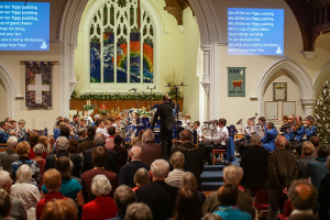 The combined Godalming Band and Youth Band leading the congregation at the Christmas concert